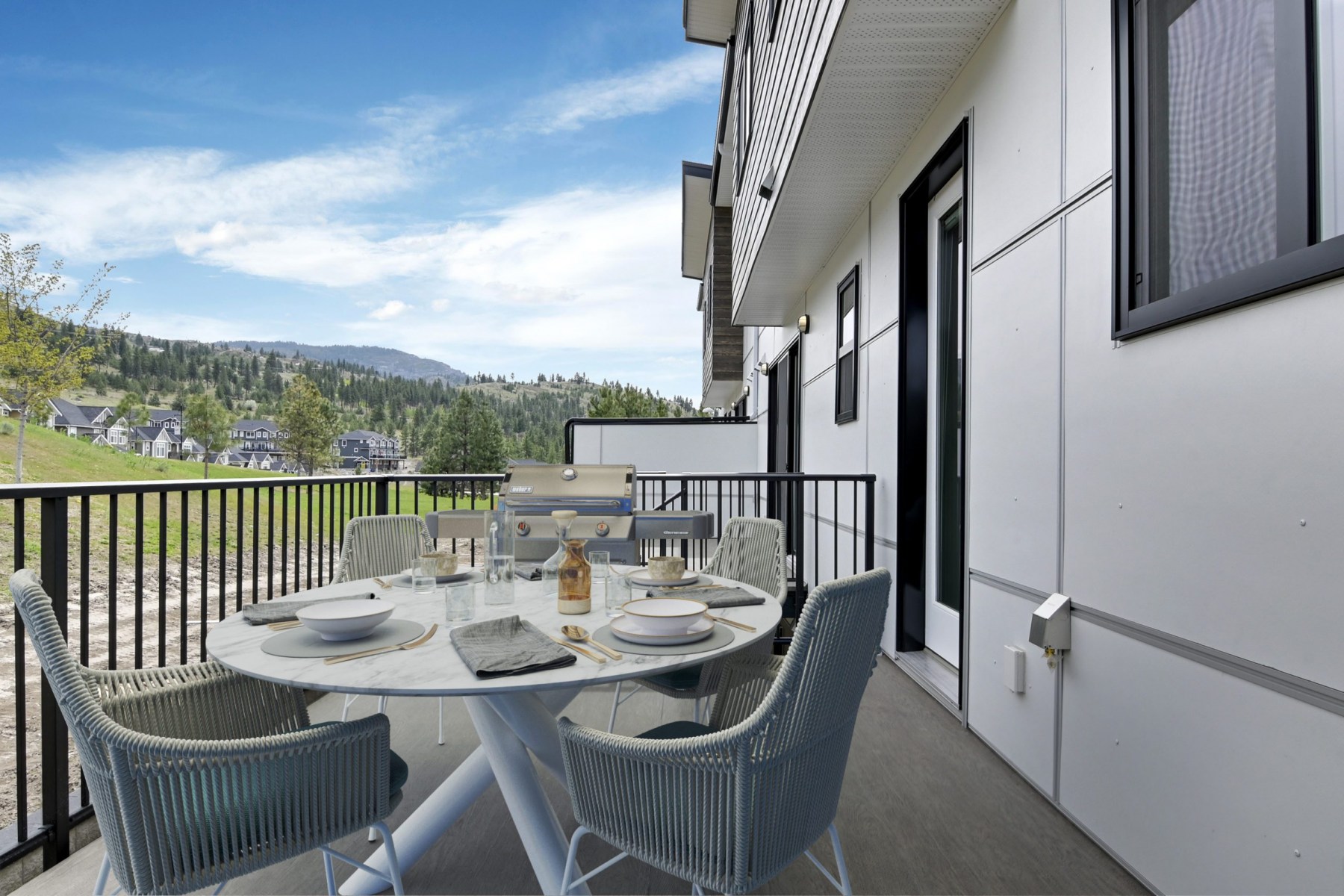 harmony_homes_the_ridge_multi_family_project_balcony_table_chairs_gallery_image_11